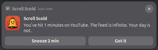 Scroll Scold notification saying: You've hit 1 minutes on YouTube. The feed is infinite. Your day is not. With Snooze 2 min and Got it buttons